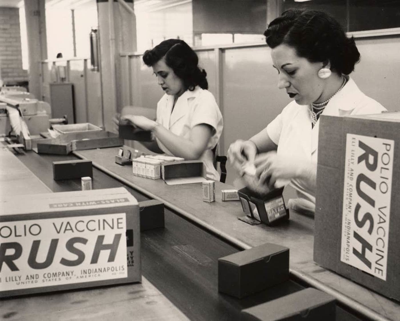 Lilly employees packing polio vaccines for shipping